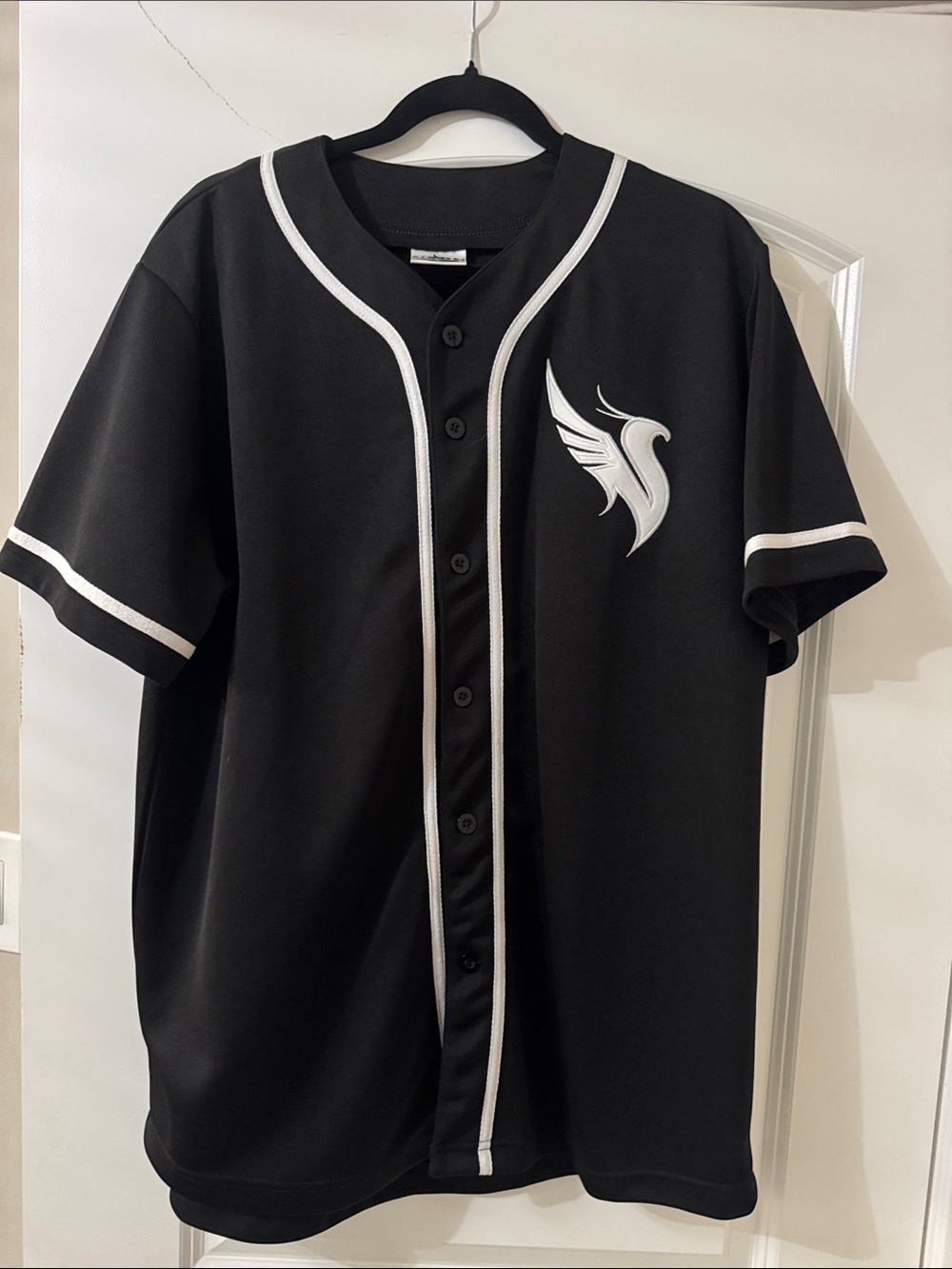 Black Baseball Jersey with White Wing Logo